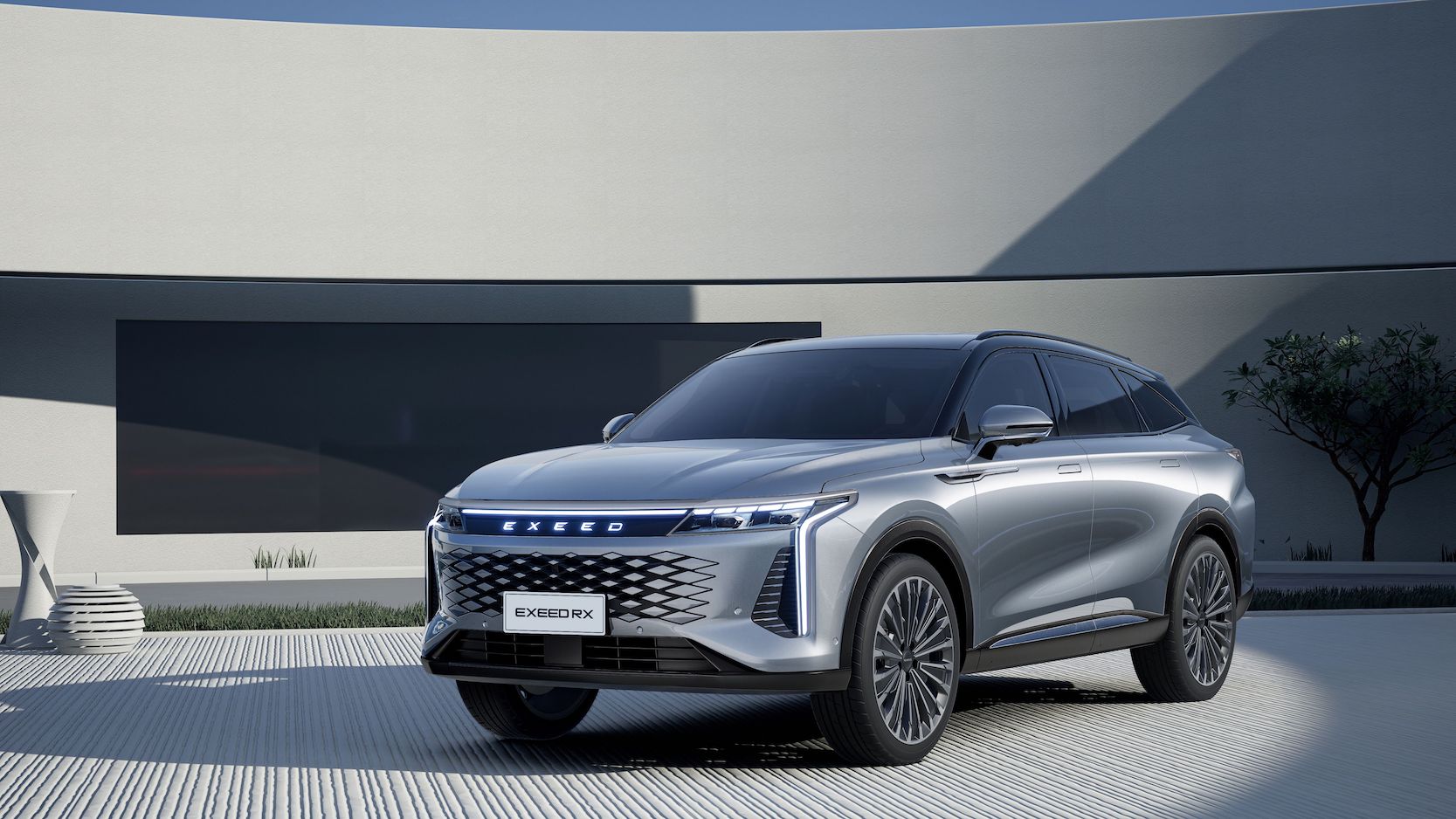 Silver Exeed RX SUV showcasing sleek design and LED headlights.